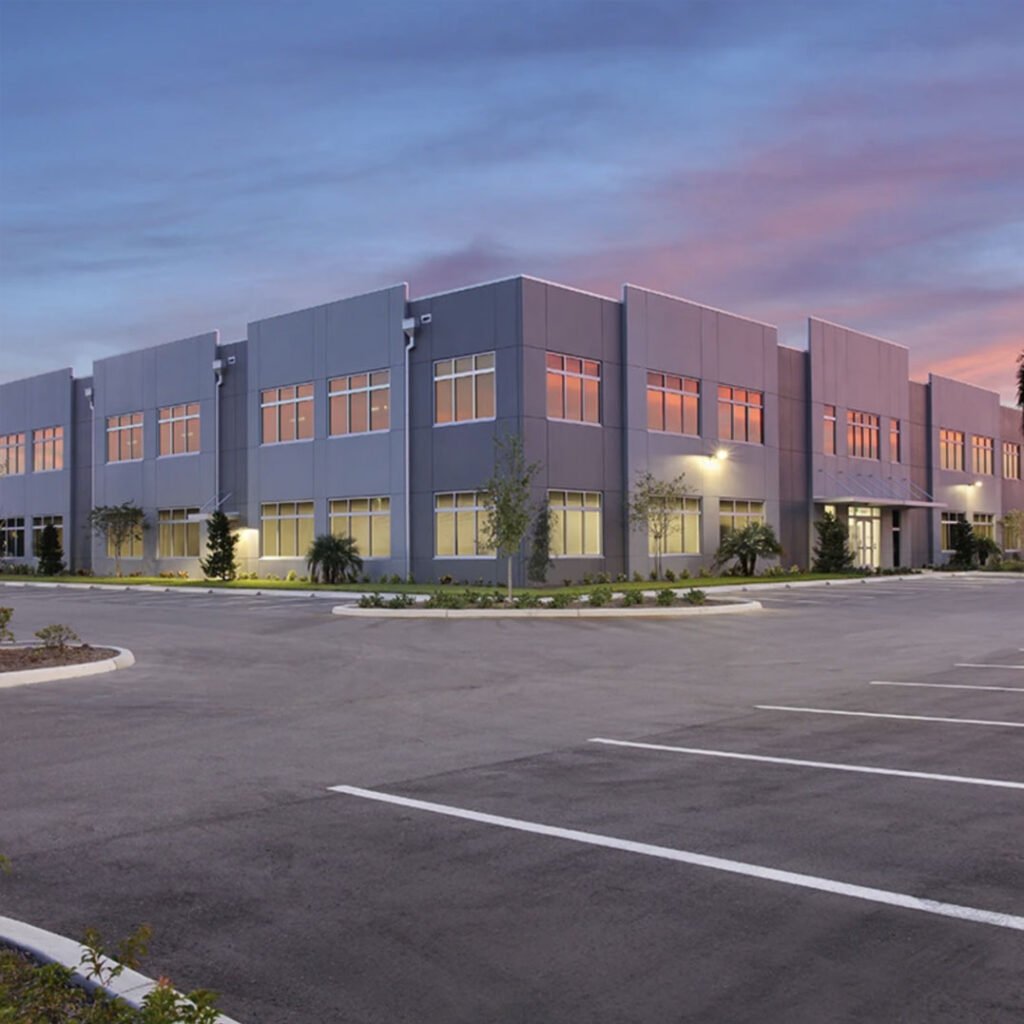 Photo of a commercial parking lot with a building background
